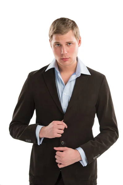Portrait of a confident young male executive buttoning his cuff — Stock Photo, Image