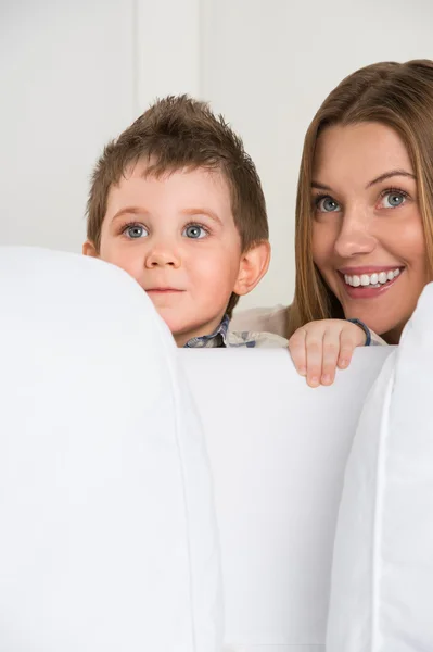 Happy young mother and her cute son playing at home — Stock Photo, Image