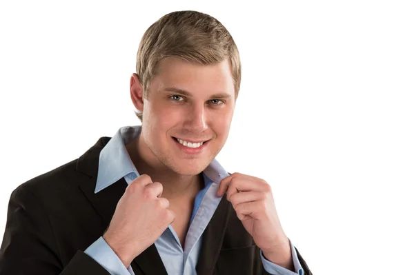 Portrait of a confident young businessman standing against white background — Stock Photo, Image