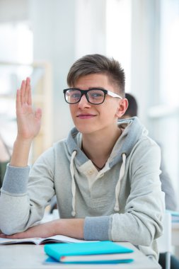High School students. Student raising his hand in university clipart