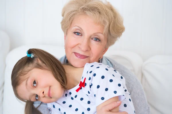 Lovely little girl with her grandmother having fun and happy mom — Stock Photo, Image