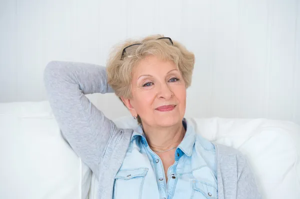 Smiling happy senior woman relaxing at home — Stock Photo, Image