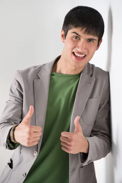 Happy smiling young man leaning — Stock Photo, Image