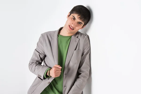 Happy smiling young man leaning — Stock Photo, Image