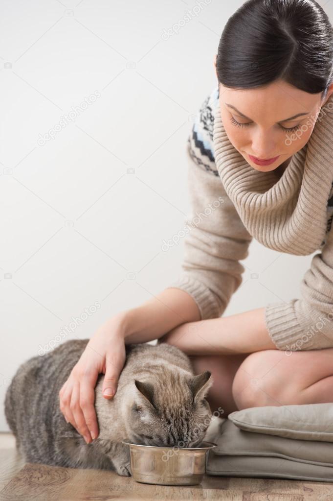 Beautiful young woman and her cat