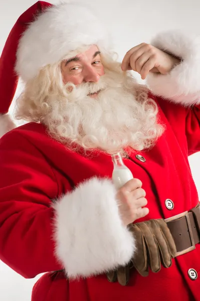 Portrait of Santa Claus Drinking milk from glass bottle — Stock Photo, Image