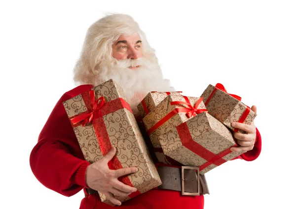 Retrato de Papai Noel com caixas de presente olhando para longe — Fotografia de Stock