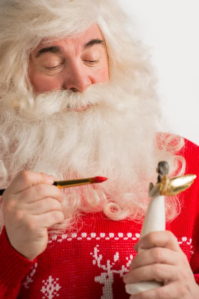 Santa Claus making toys — Stock Photo, Image
