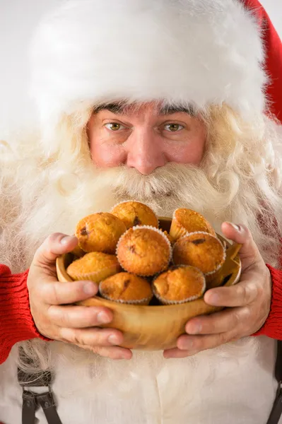 Closeup Santa Claus portrait - holding cookies and looking at ca — Stock Photo, Image