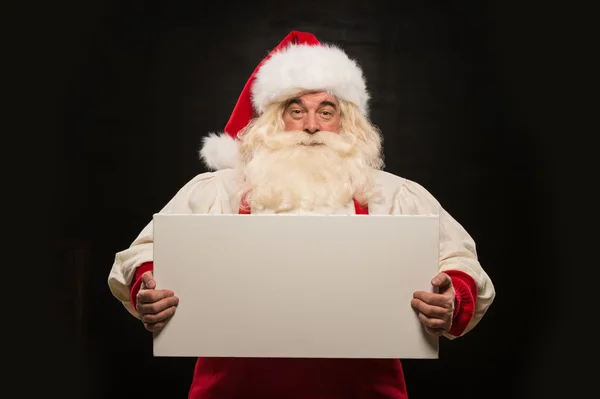 Weihnachtsmann mit weißem Blanko-Schild — Stockfoto