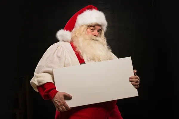 Weihnachtsmann mit weißem Blanko-Schild — Stockfoto