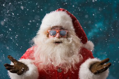 Santa Claus wearing sunglasses dancing outdoors at North Pole clipart
