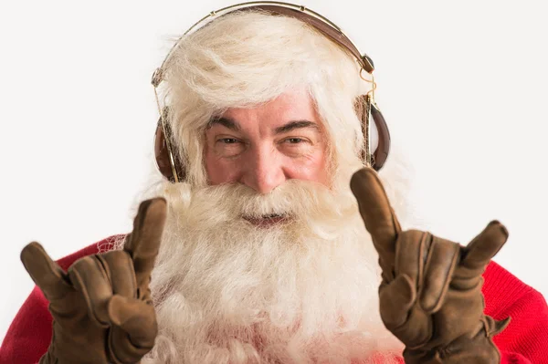 Santa Claus listening to the music — Stock Photo, Image