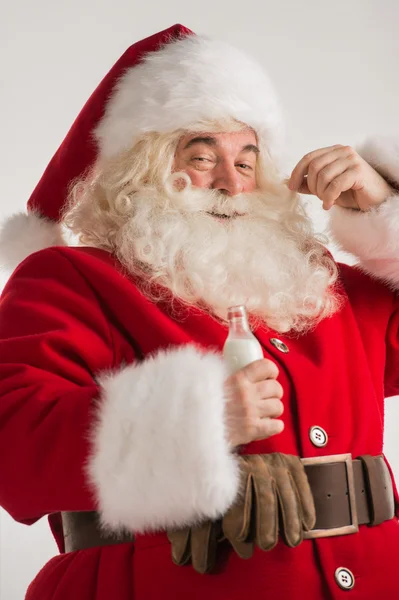 Santa Claus drinking milk — Stock Photo, Image