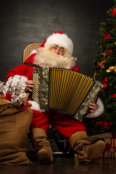 Santa Claus sitting in armchair — Stock Photo, Image