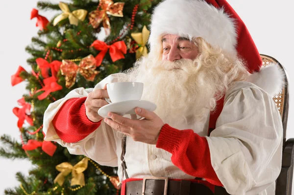 Santa Claus sitting in rocking chair — Stock Photo, Image