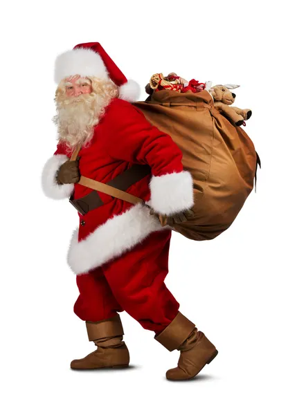 Père Noël portant un grand sac — Photo