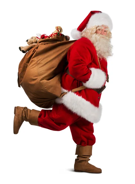 Santa Claus llevando bolsa grande — Foto de Stock