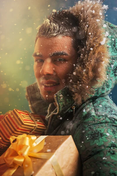 Man carrying Christmas Gifts — Stock Photo, Image