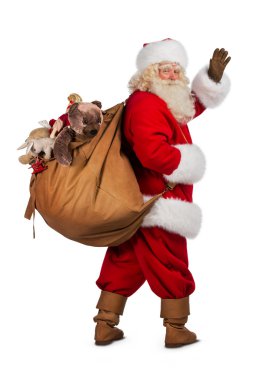 Real Santa Claus carrying big bag clipart