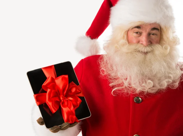 Papai Noel segurando presente Tablet computador — Fotografia de Stock