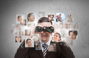 Business man looking for employees through binoculars. clipart