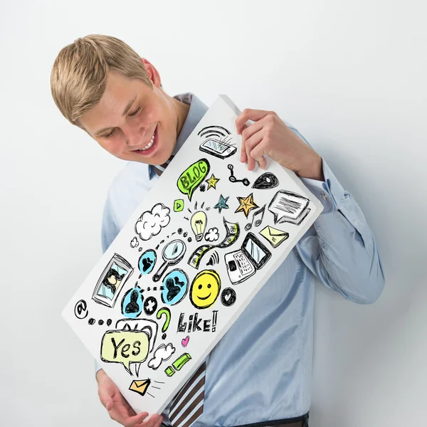 Business man holding a sign with online services symbols — Stock Photo, Image