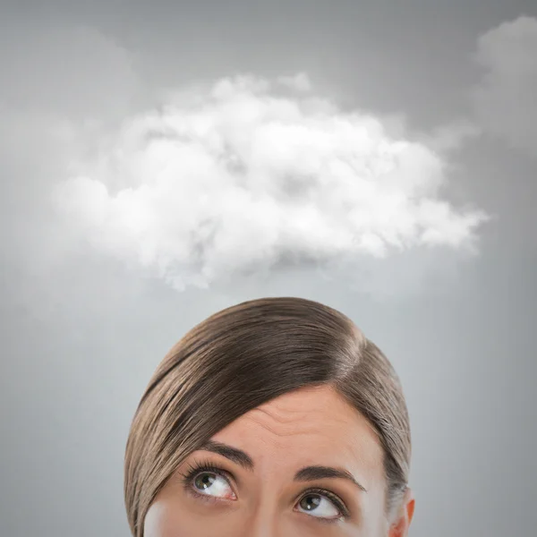 Close up of young woman looking up for thought bubble above her head with copy space — Stock Photo, Image