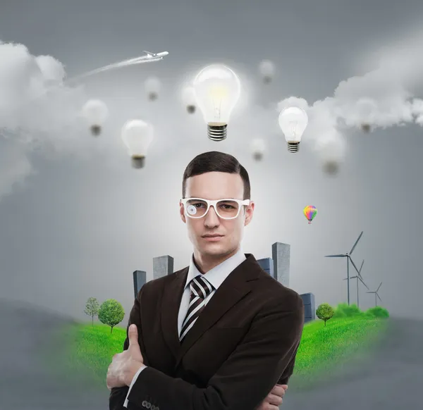 Ecology ideas concept. Businessman standing in front of cityscape — Stock Photo, Image