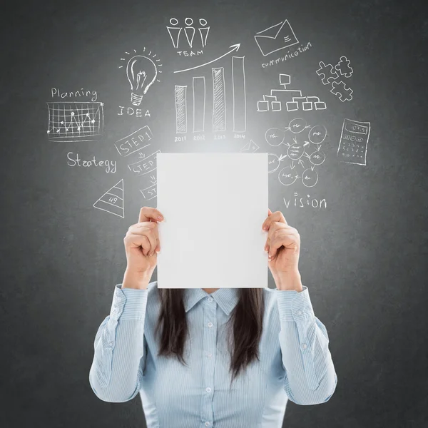 Businesswoman showing book of success and hiding her face behind — Stock Photo, Image