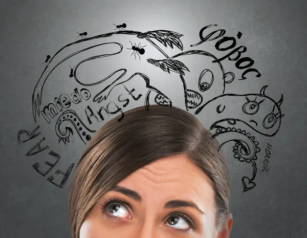 Young business woman thinking of her fearsand doubts closeup face portrait and sketches overhead — Stockfoto