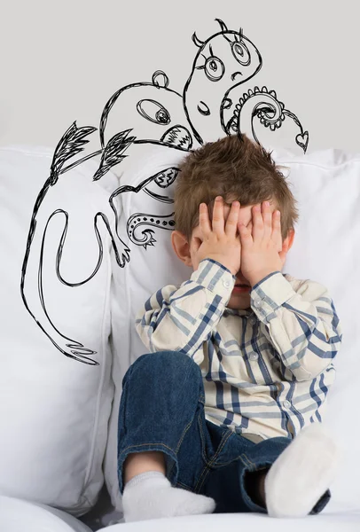 Scared boy hiding his face. Sketches of his fictional fears around him — Stock Photo, Image