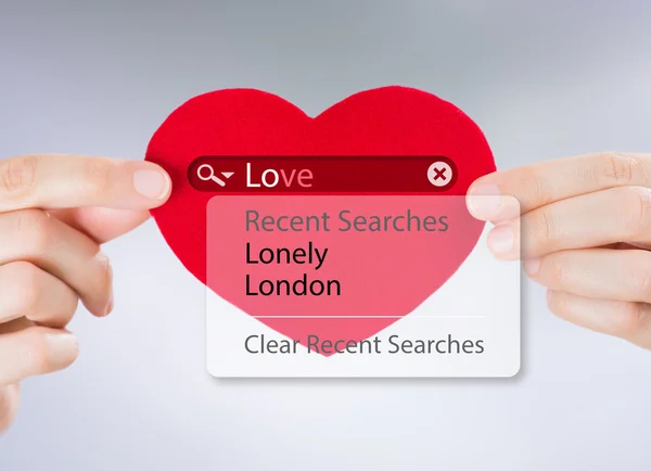 Love search. Female hands holding red heart with love search options — Stock Photo, Image