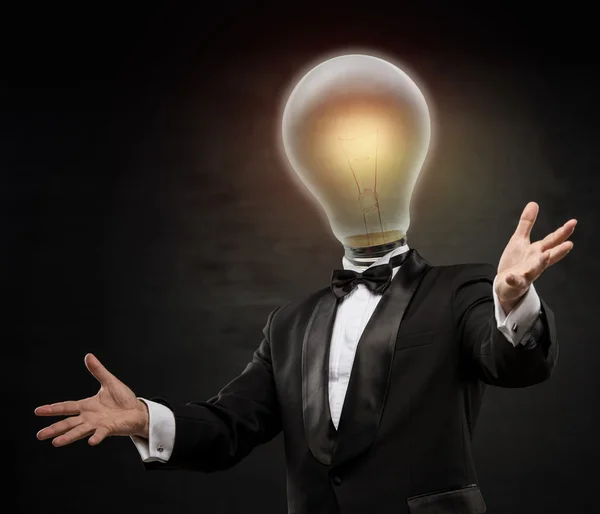 Businessman with lamp head — Stock Photo, Image