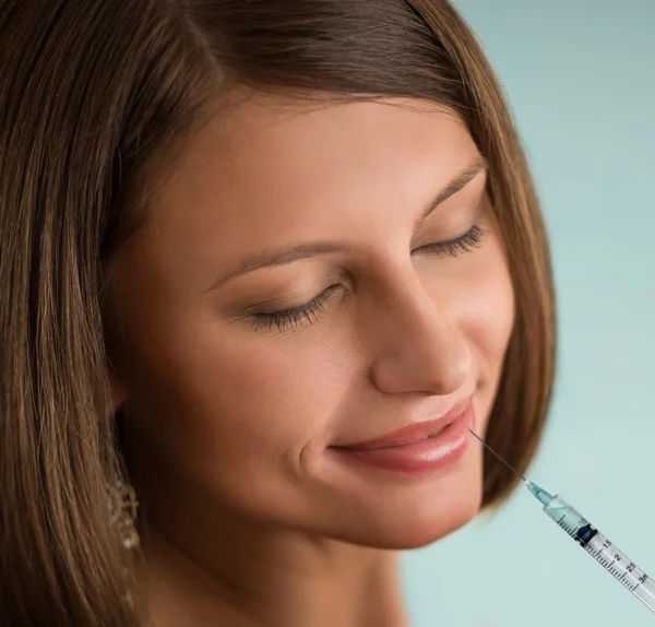 Woman with syringe lips — Stock Photo, Image