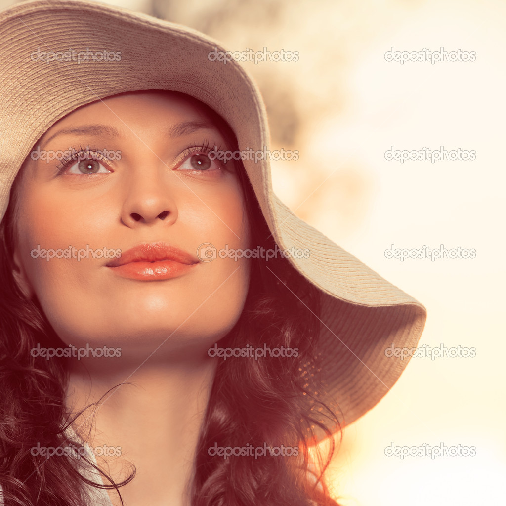 Young and beautiful woman wearing a hat