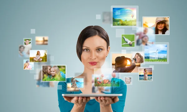 Portrait of young happy woman sharing her photo and video files — Stock Photo, Image