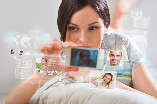 Young pretty woman using social media on her smartphone