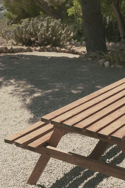 Wooden table in park — Stock Photo, Image