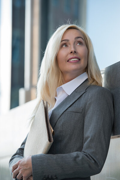 Businesswoman holding documents