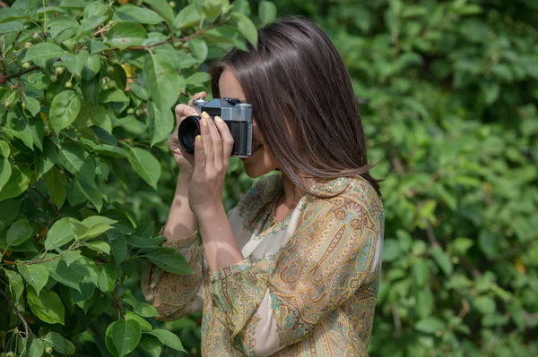 Girl with vintage retro camera — Stock Photo, Image