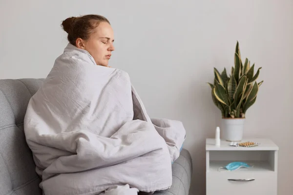 Sad Tired Woman Hair Bun Sitting Sofa Wrapped Blanket Felling — Stock Photo, Image