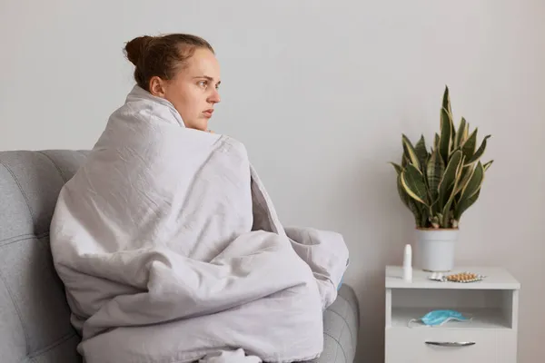 Tired Woman Hair Bun Sitting Sofa Wrapped Blanket Feels Cold — Stock Photo, Image