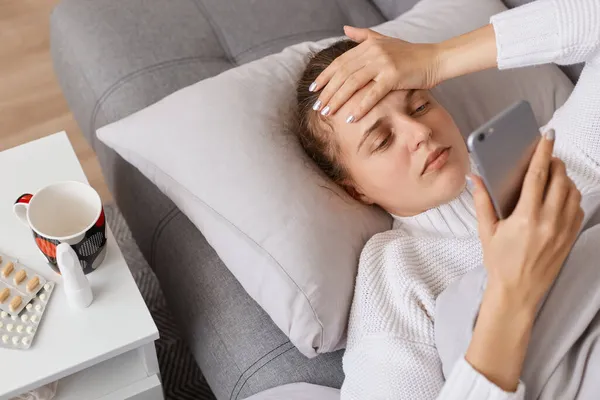 Portrait Unhealthy Lying Sofa Touching Her Forehead Having Terrible Headache — Stock Photo, Image