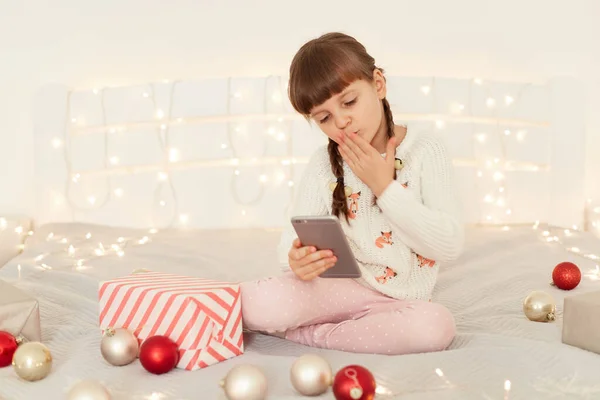 Adorable Female Kid Sitting Bed Present Boxes Baubles Having Video — Stock Photo, Image