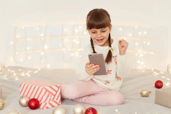 Happy Little Adorable Girl Wearing White Casual Sweater Sitting Bed — Stock Photo, Image