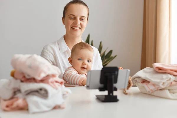 Indoor Shot Delighted Young Adult Woman Blogger Posing Infant Daughter — Stock Photo, Image