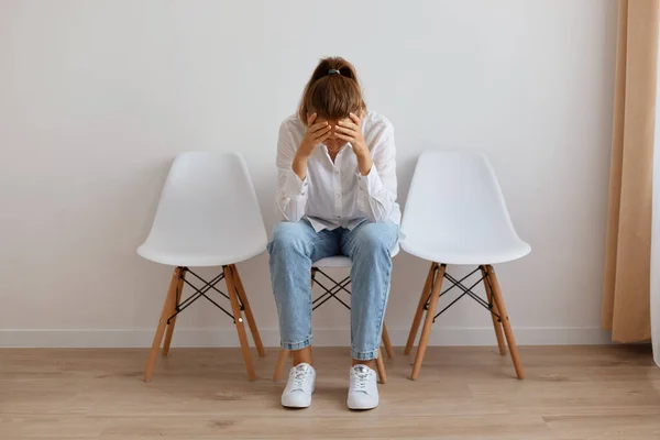 Indoor Shot Tired Exhausted Woman Wearing White Shirt Sitting Chair — стоковое фото