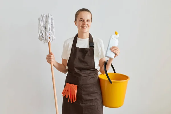 Indoor Shot Positive Woman Wearing Brown Apron Jeans Cleaning Her — Stock Photo, Image