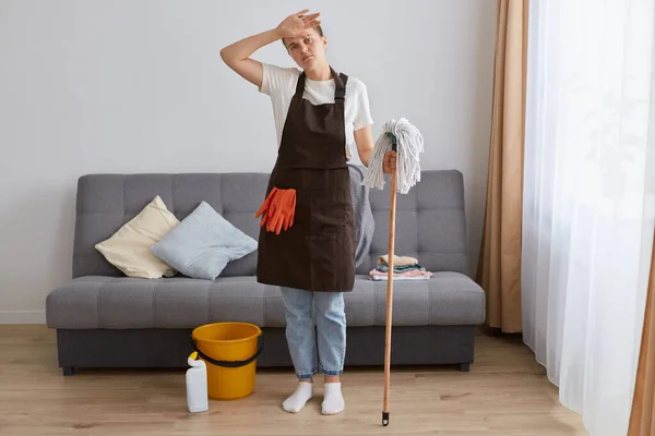 Full Length Portrait Tired Sad Woman Wearing Brown Apron Casual — Stock Photo, Image